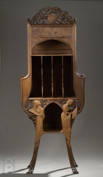 Artwork by René Defland, Score cabinet in  of two young women, Made of carved and molded cherry wood with orange wood decoration