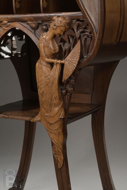 Artwork by René Defland, Score cabinet in  of two young women, Made of carved and molded cherry wood with orange wood decoration