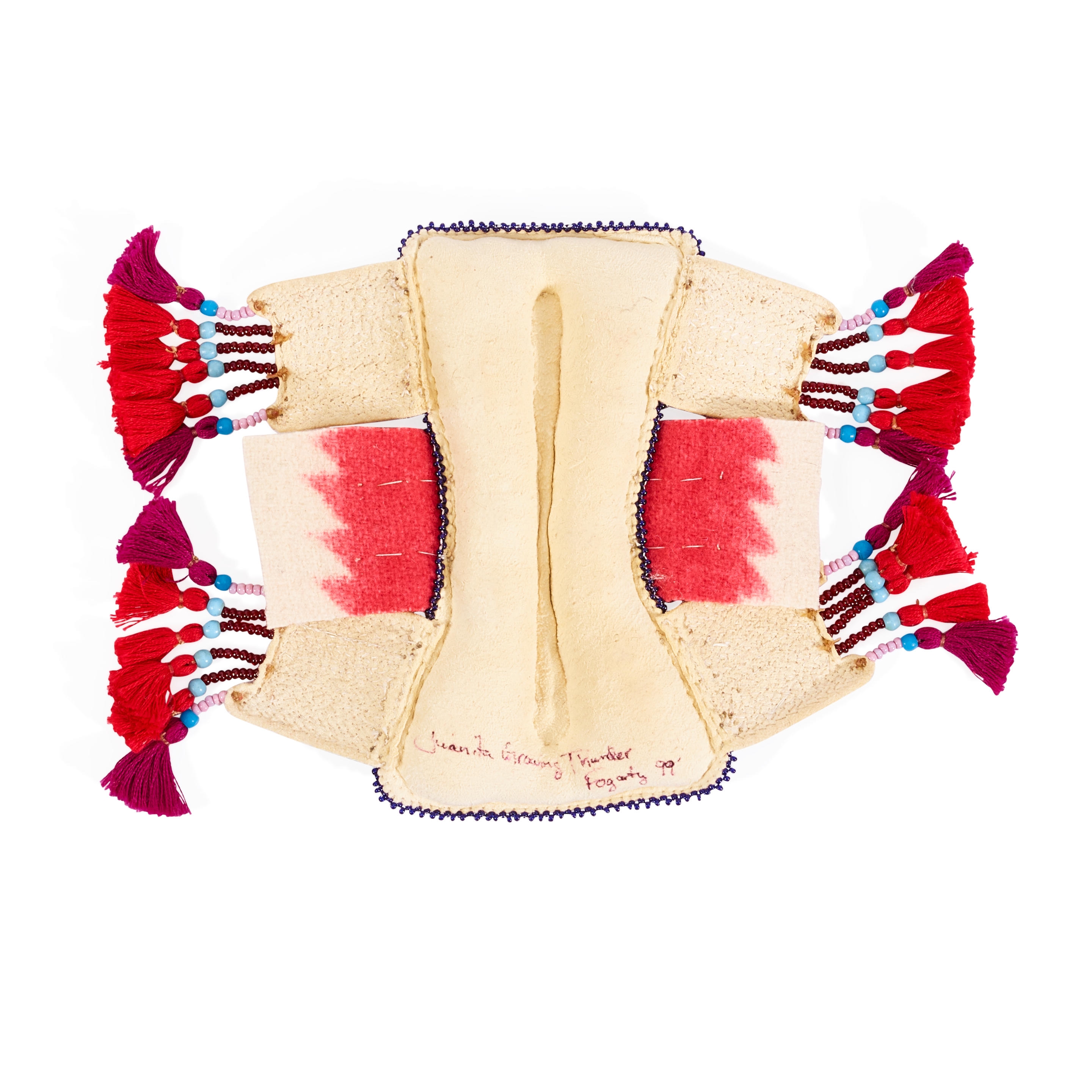 Artwork by Juanita Growing Thunder Fogerty, Miniature interpretation of a Nêhiyawak (Plains Cree) pad saddle, Made of panels at each corner adorned with bead and yarn suspensions