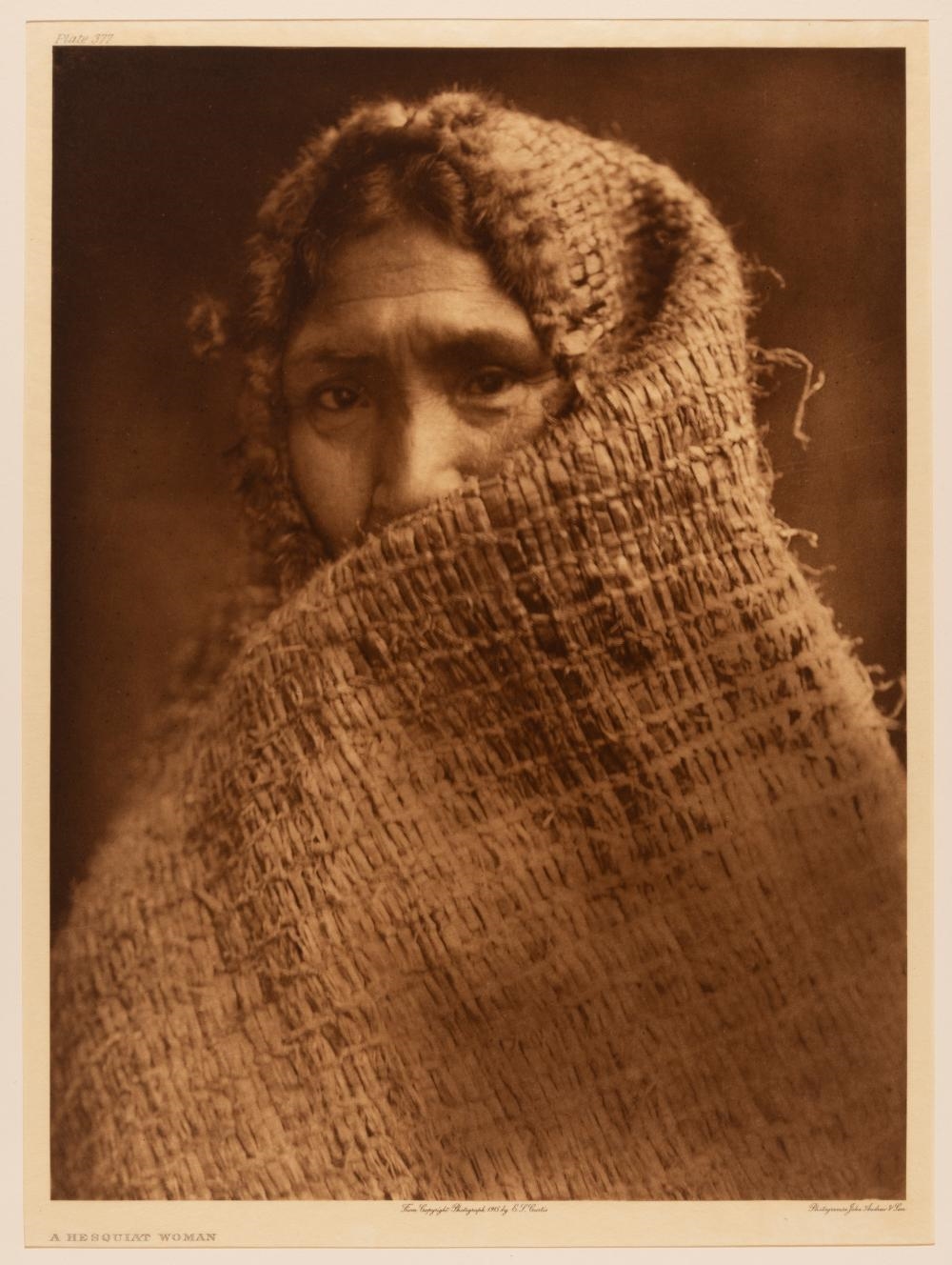Artwork by Edward S. Curtis, Group of Three Photogravures: Painting a Hat - Nakoaktok, 1914 + A Hesquiat Woman, 1915 + Nootka Woman Wearing Cedar-Bark Blanket, 1915, Made of Photogravures