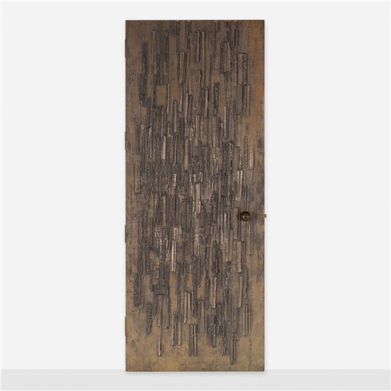 A vertical wooden panel featuring a dense, textured pattern of dark, elongated shapes resembling rain or vertical lines.