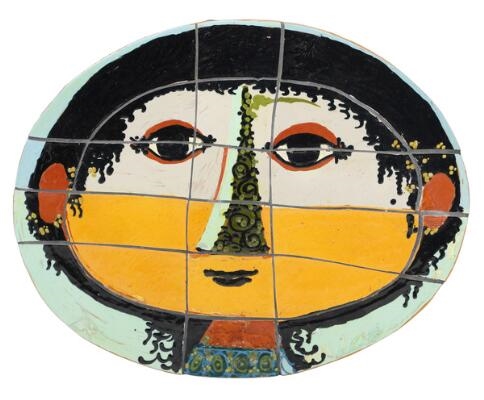 A circular stoneware relief decorated with a face in polychrome glaze - Bjorn Wiinblad
