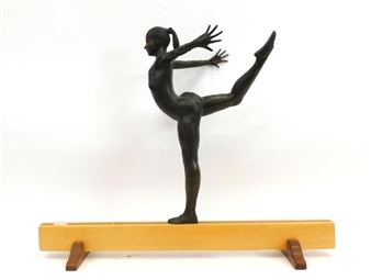 sculpture. Depicting young female gymnast. Bronze figure on a wooden balance beam. The bronze size is 25" high - Clayton E. Fuller