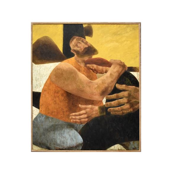 A figure in an orange shirt sits with their head bowed, hands clasped over a dark object.