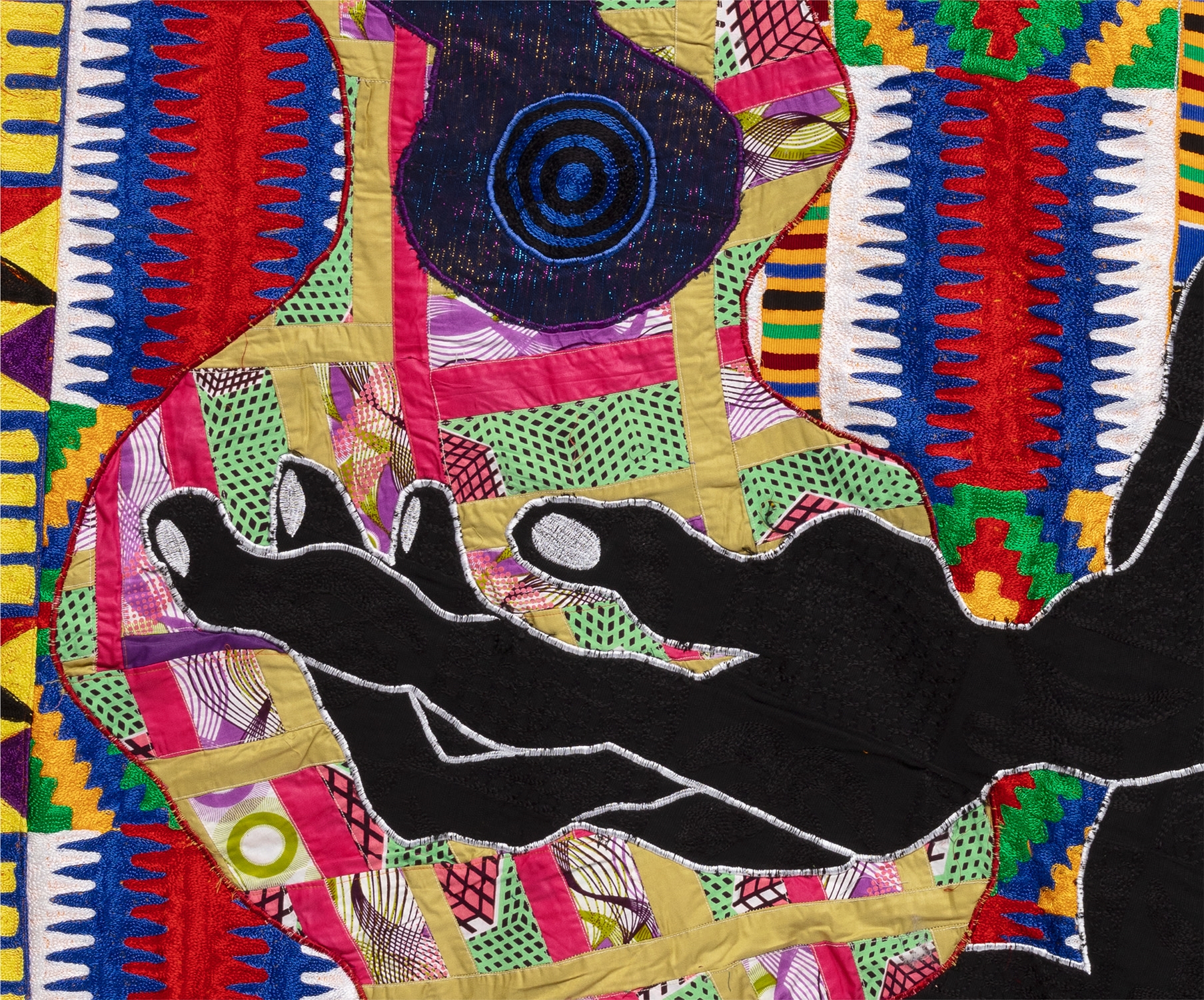 Artwork by Basil Kincaid, Formulation of Worlds, Selves and Bodies, Made of quilt hand-woven Ghanian kente, wax block print cotton fabric, donated clothes, clothes from the artist, Ghanian embroidered fabrics, embroidery and wool