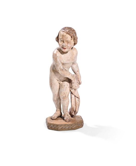A CARVED WHITE PAINTED FIGURE OF A CHILD - Spanish School, 18th Century