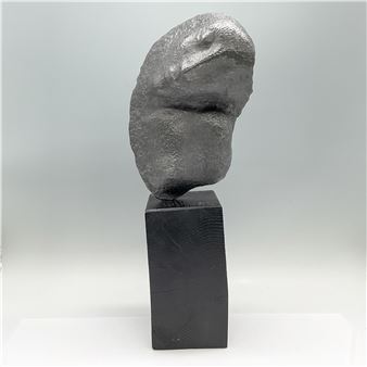 Sculpted lead repousse of a woman tilting her head on her shoulder - James Richard Caudle