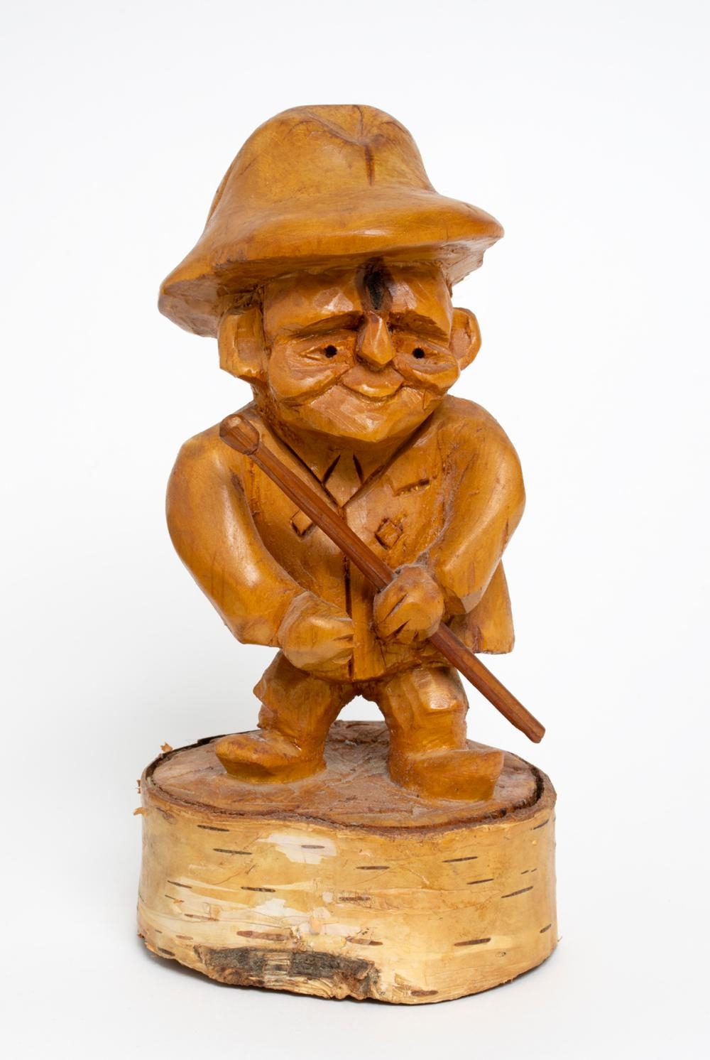 Artwork by John Moyles, Man with Walking Stick, Made of Carved wooden sculpture