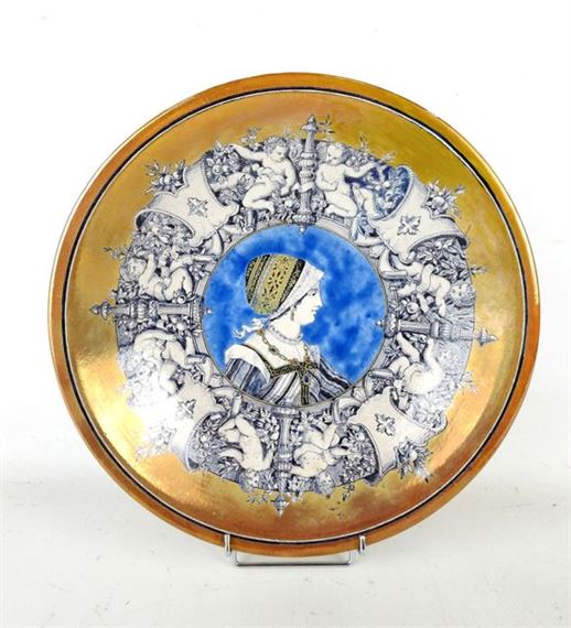 Polychrome earthenware circular dish with partially iridescent decoration, decorated in the center with a female profile within a round of putti by Ulysse Besnard, dated December 1878