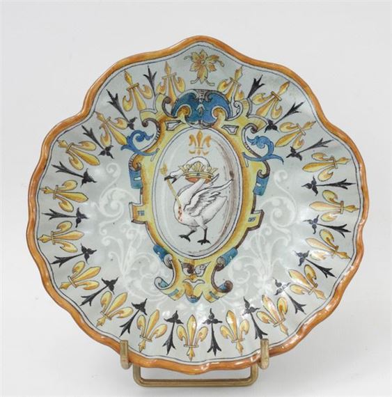 Polychrome earthenware shell-shaped pocket scoop decorated with a swan pierced by an arrow and a crown of lilies by Ulysse Besnard, dated July 1878