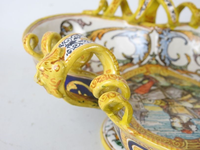 Artwork by Ulysse Besnard, Polychrome earthenware three-lobed pedestal bowl decorated with arabesques, fauns and a central cartouche featuring a Renaissance man, Made of Polychrome earthenware