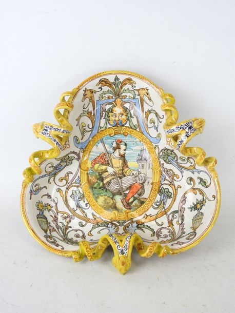 Artwork by Ulysse Besnard, Polychrome earthenware three-lobed pedestal bowl decorated with arabesques, fauns and a central cartouche featuring a Renaissance man, Made of Polychrome earthenware