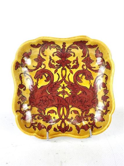 An earthenware scalloped-pocket with iridescent decoration of hybrid animals on a yellow ground by Ulysse Besnard, dated May 1878