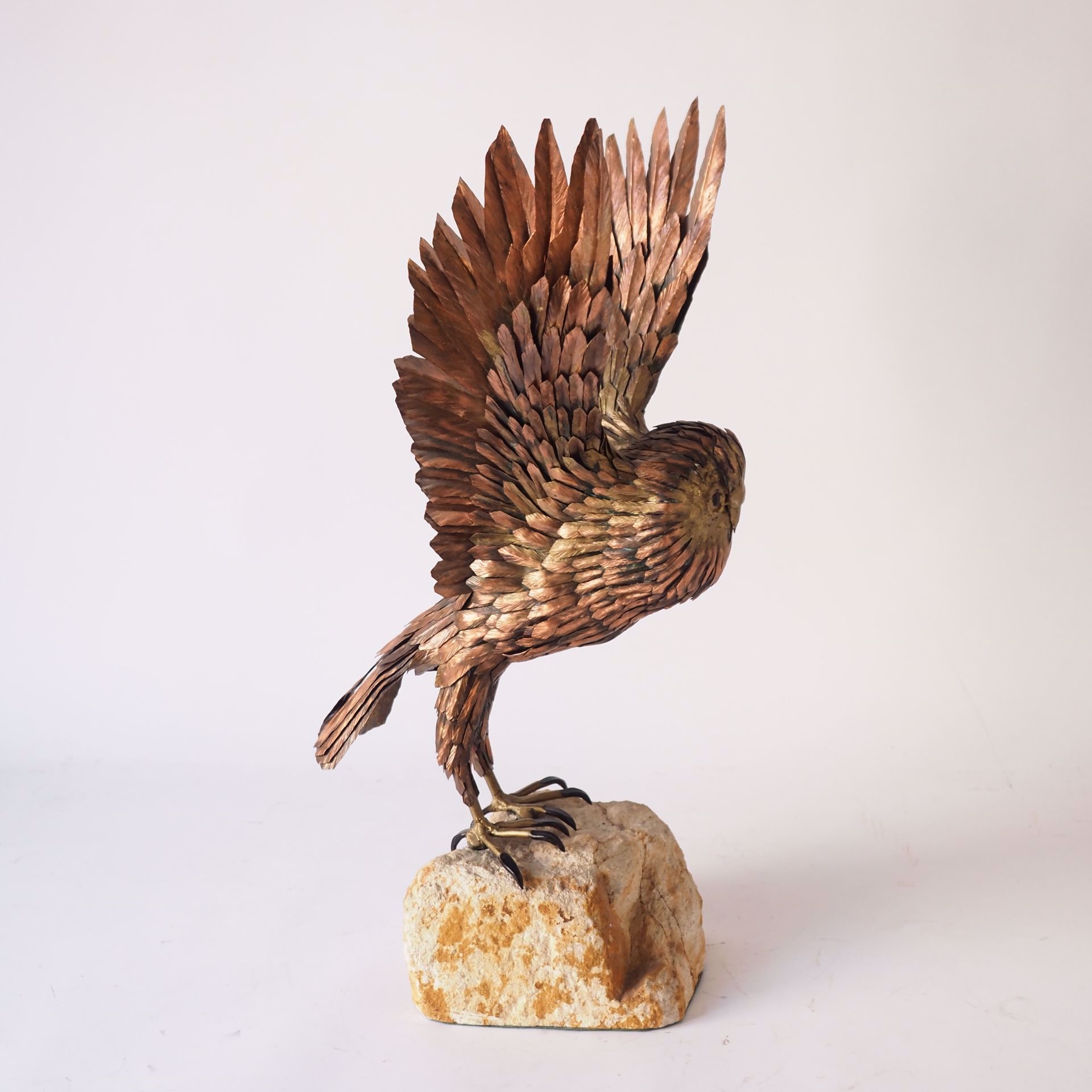 Artwork by Roger Pintens, Owl: metal sculpture on stone rock, Made of metal sculpture on stone