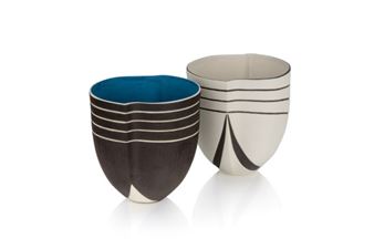Two hand carved lipped bowls. One with a black exterior with white stripes and indigo interior. One with white exterior with black stripes and white interior. and signature on the bottom of both. H - Penny Fowler