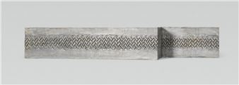 A minimalist sculpture featuring two concrete blocks with a woven metal band.