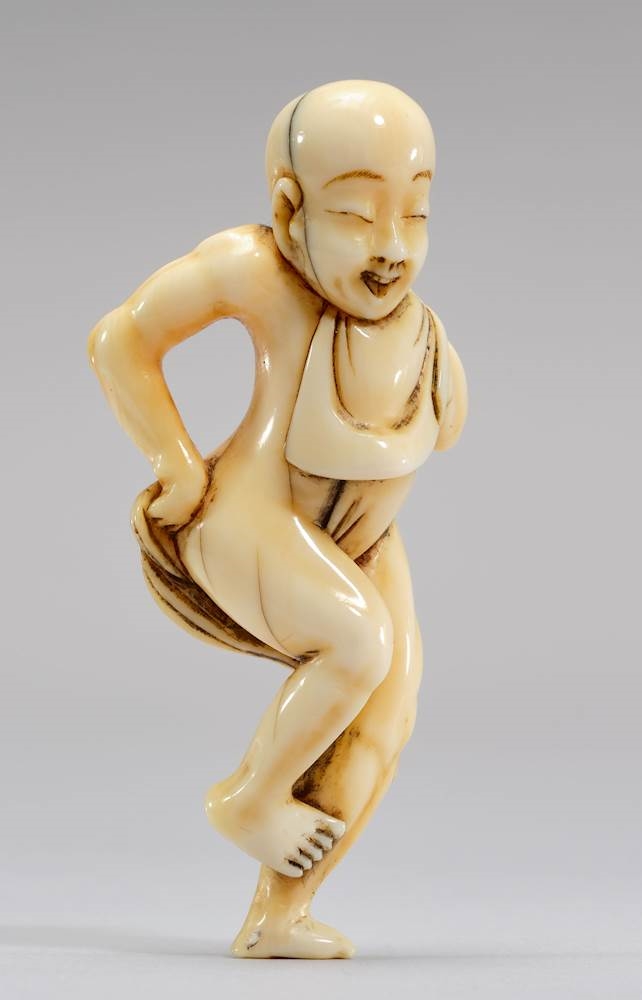 Japanese School, 19th Century | A NETSUKE OF A BATHING MAN (19) | MutualArt