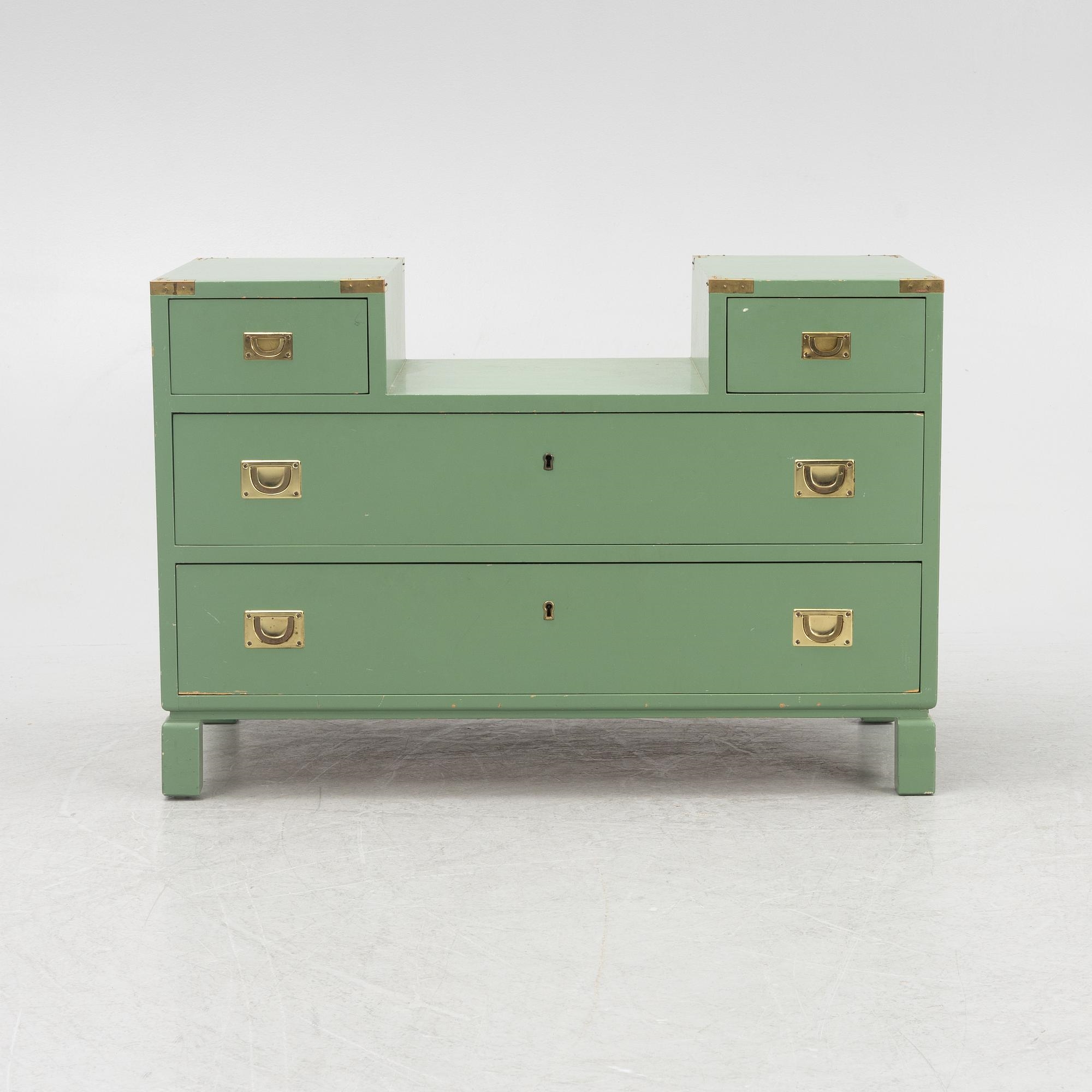 Artwork by Ove Feuk, Ove Feuk, a chest of drawers, Nordiska Kompaniet 1970s, Made of green lacquered with brass fittings