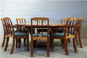 a burr maple and thuya dining table and eight chairs - Andrew Varah