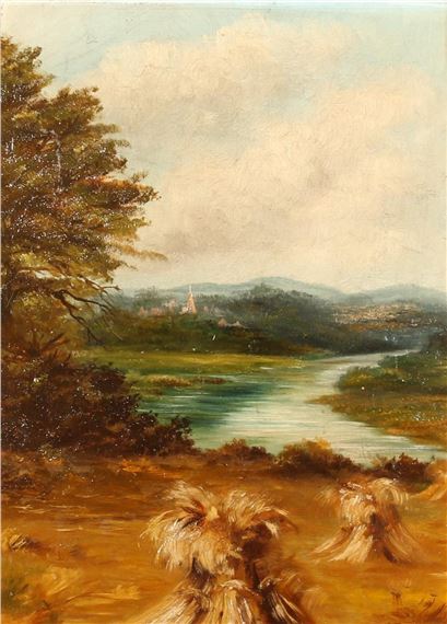 Corn stooks by a river with a town in the distance