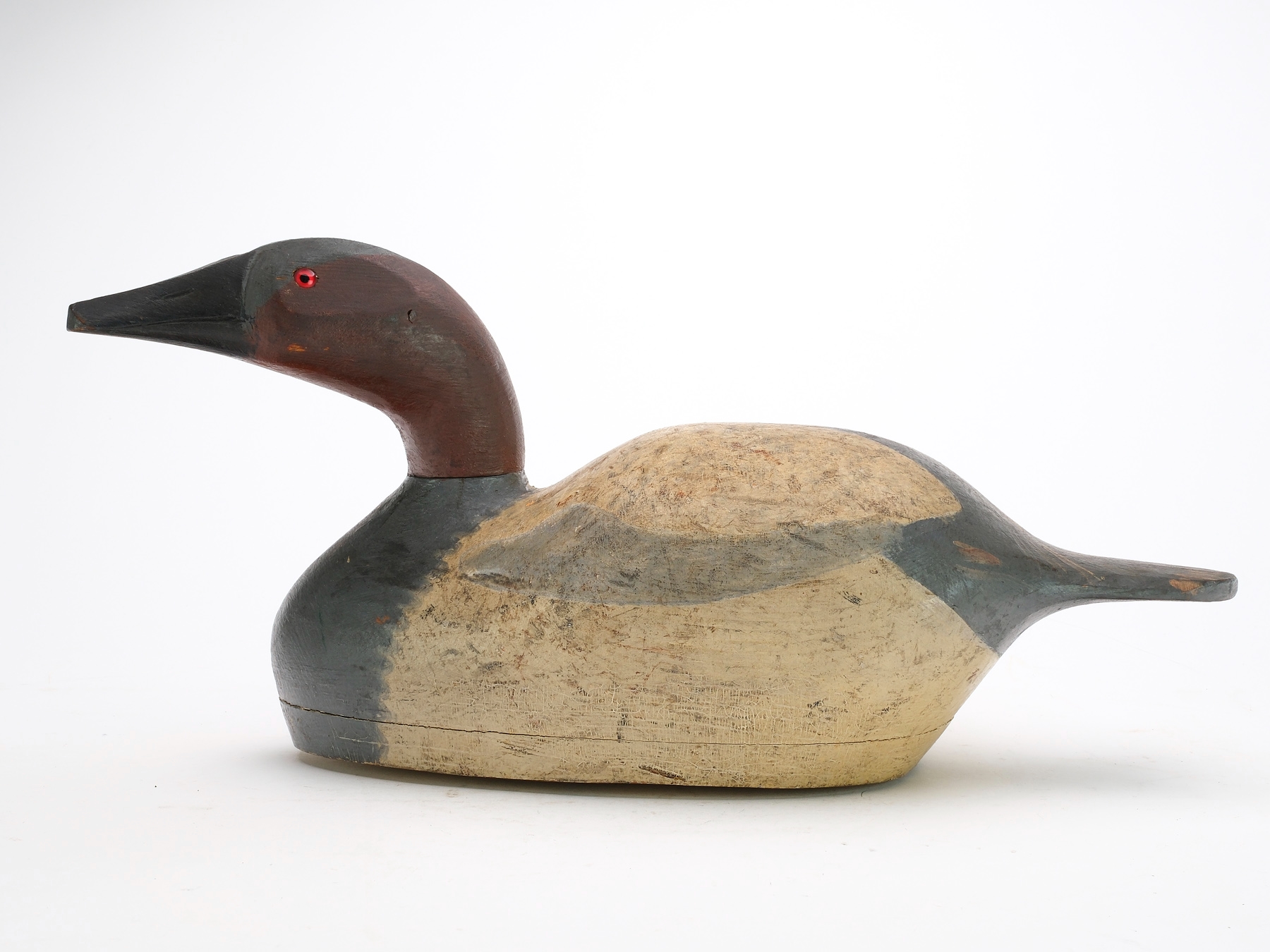 Artwork by August Moak, Hollow carved canvasback with slightly turned head and chamfered bottom board