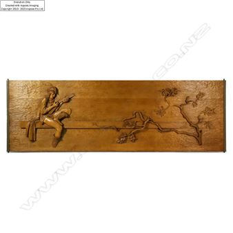 "A wooden relief panel featuring a seated figure playing an instrument, connected by a branch to blossoming flowers."