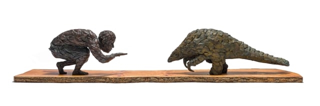 Artwork by Robert Rorich, Pangolin Boy, Made of bronze with a brown patina
