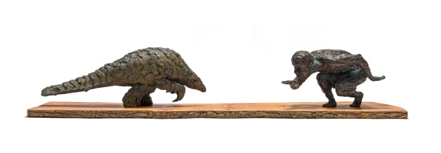 Artwork by Robert Rorich, Pangolin Boy, Made of bronze with a brown patina