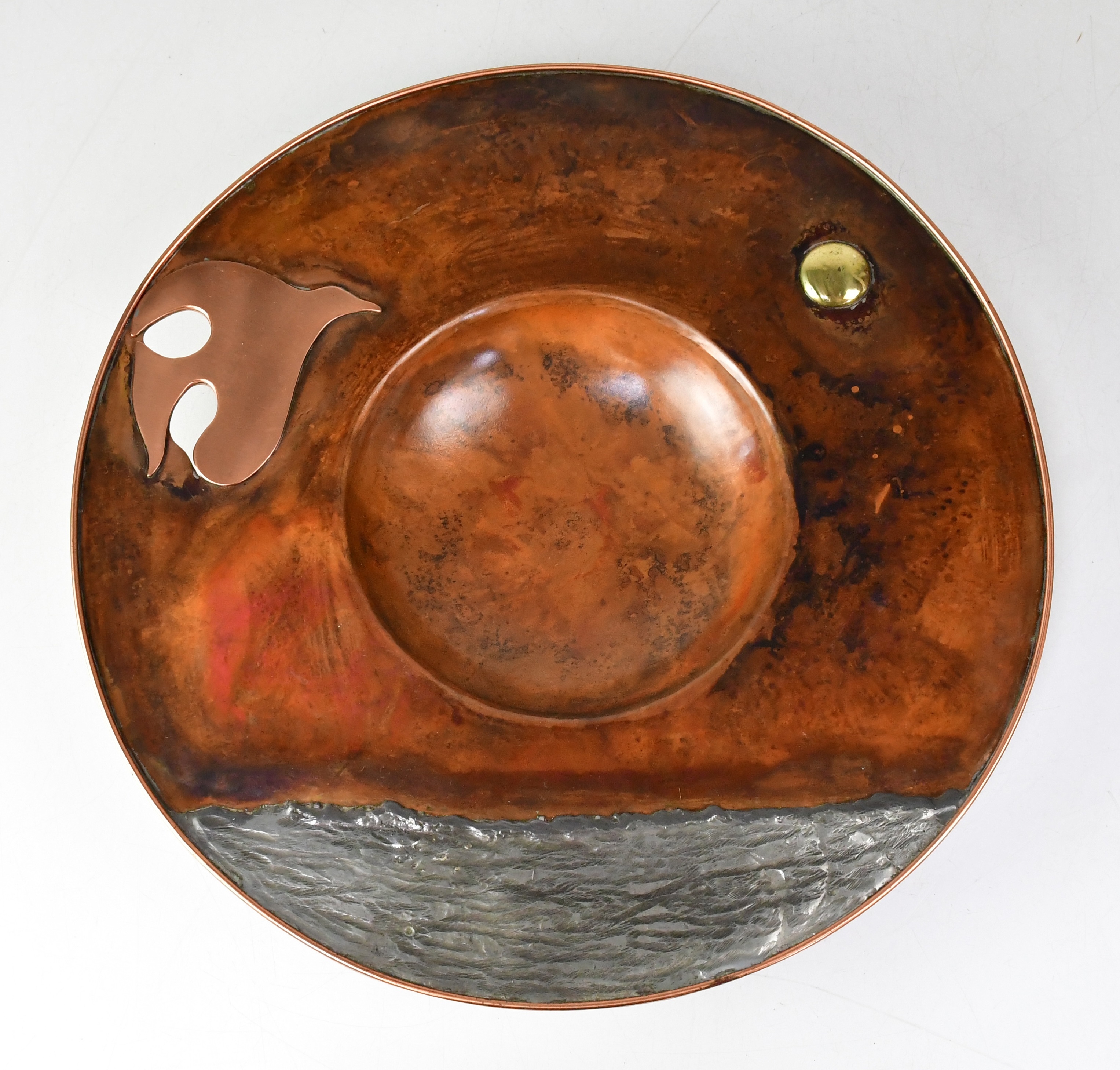 Artwork by Sam Fanaroff, SAM FANAROFF BEM (1926-2019); a circular copper and pewter bowl depicting a bird flying over water to the wide rim, Made of brass