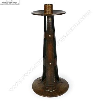 An Arts and Crafts hammered copper candlestick by Arthur John Seward - Arthur John Seward