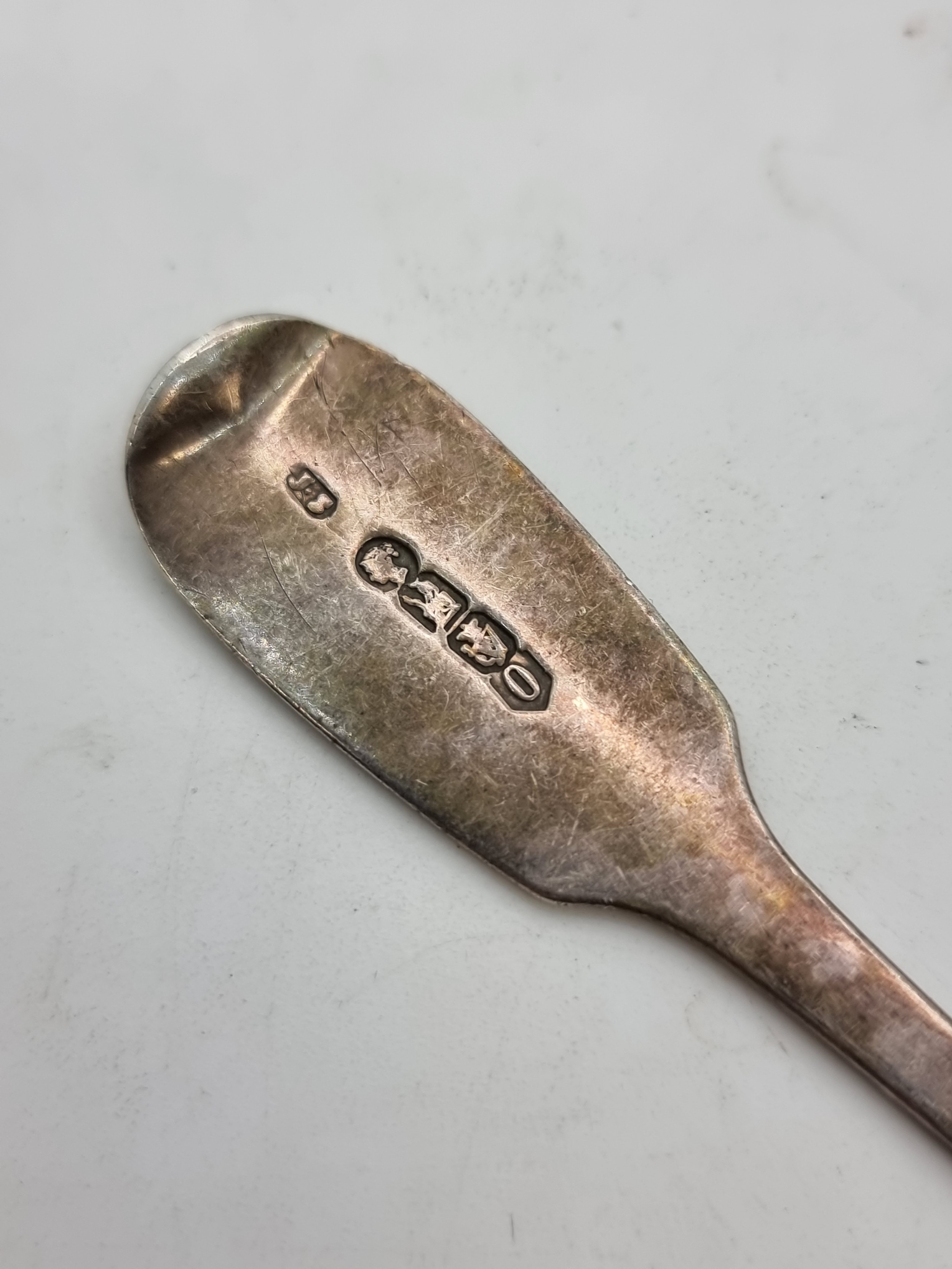Artwork by John Smyth, A Irish  desert spoon, with fiddle pattern finial and anchor markings. Hallmarked Dublin, Made of silver
