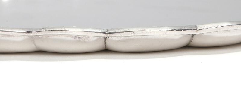 Artwork by Oscar Gundlach Pedersen, A large, circular serving tray with hammered surface and curvy rim