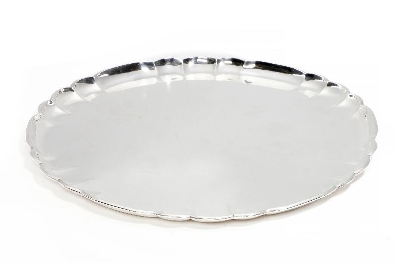 Artwork by Oscar Gundlach Pedersen, A large, circular serving tray with hammered surface and curvy rim