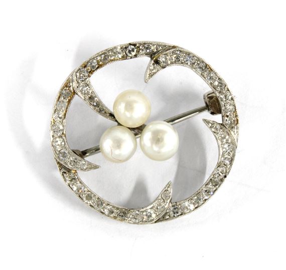 Hamilton | Diamond and pearl brooch set in a circular white metal open ...