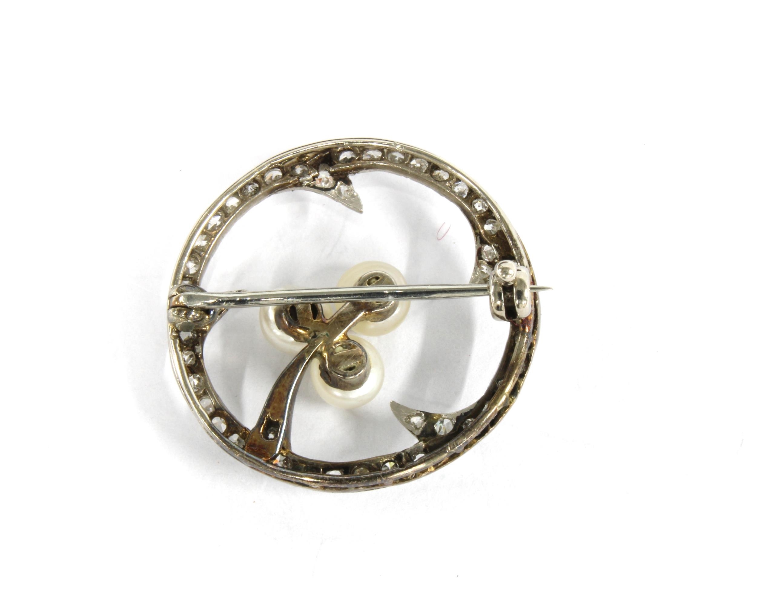 Hamilton | Diamond and pearl brooch set in a circular white metal open ...