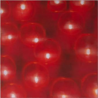 A close-up of translucent red spheres glowing with bright white centers.