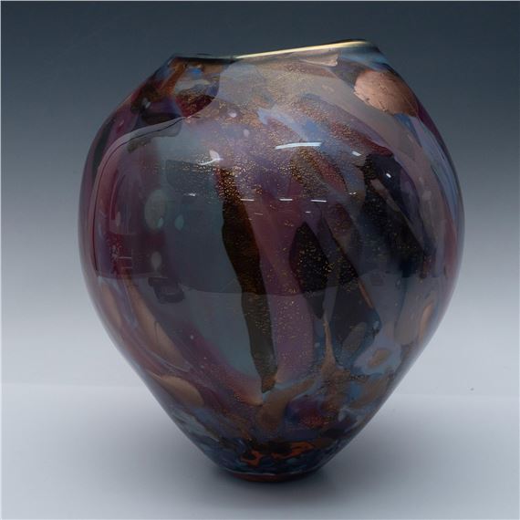 Tim Lazer | An abstract vessel decorated in various colored glass in an ...
