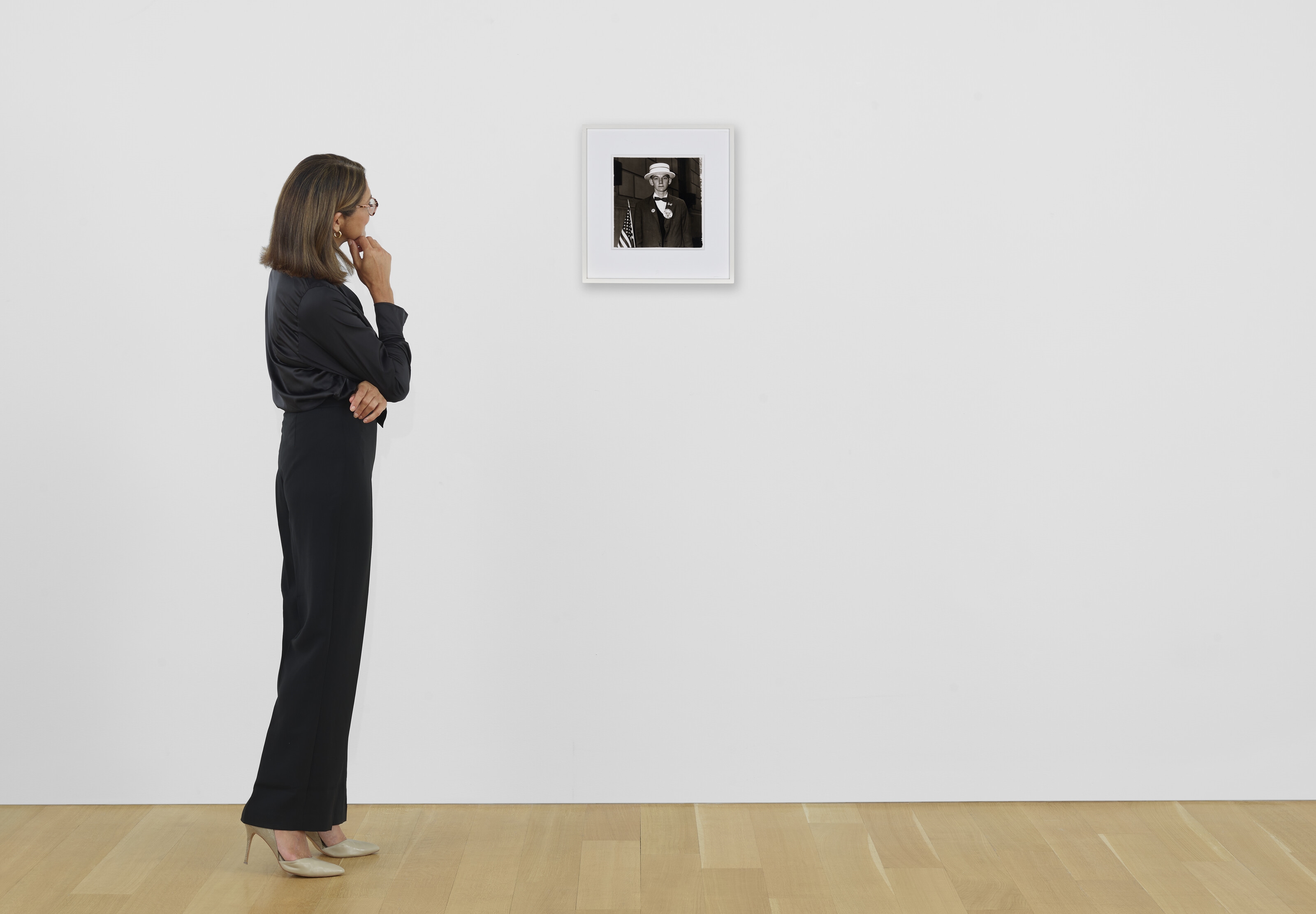 Artwork by Diane Arbus, Boy with a straw hat waiting to march in a pro-war parade, NYC, 1967, Made of gelatin silver print