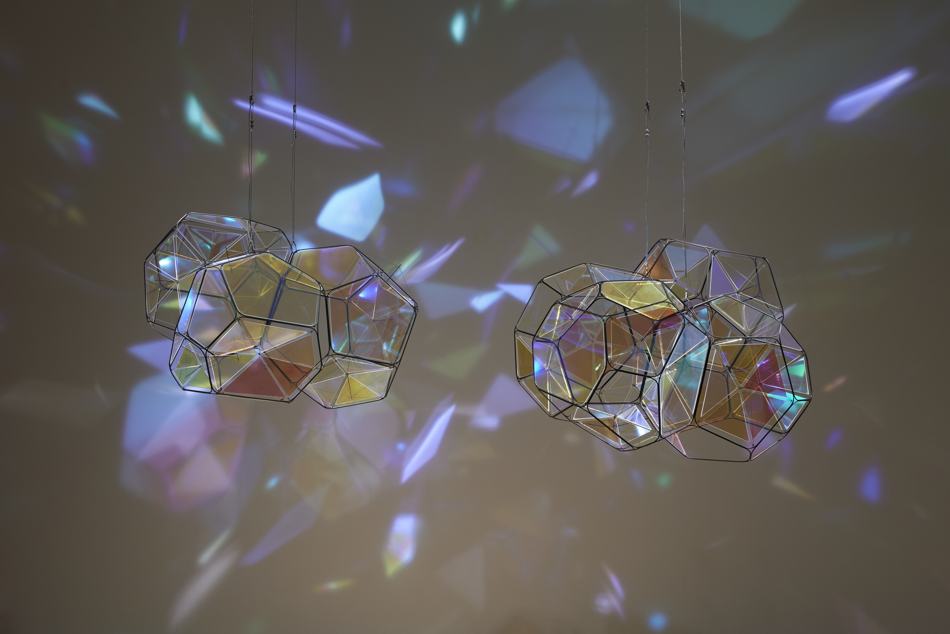 Artwork by Tomas Saraceno, GJ 581 e/M+1, Made of metal, plexiglass, monofiliment, iridescent fishing line, metal wire, carbon fiber and steel thread, in two parts