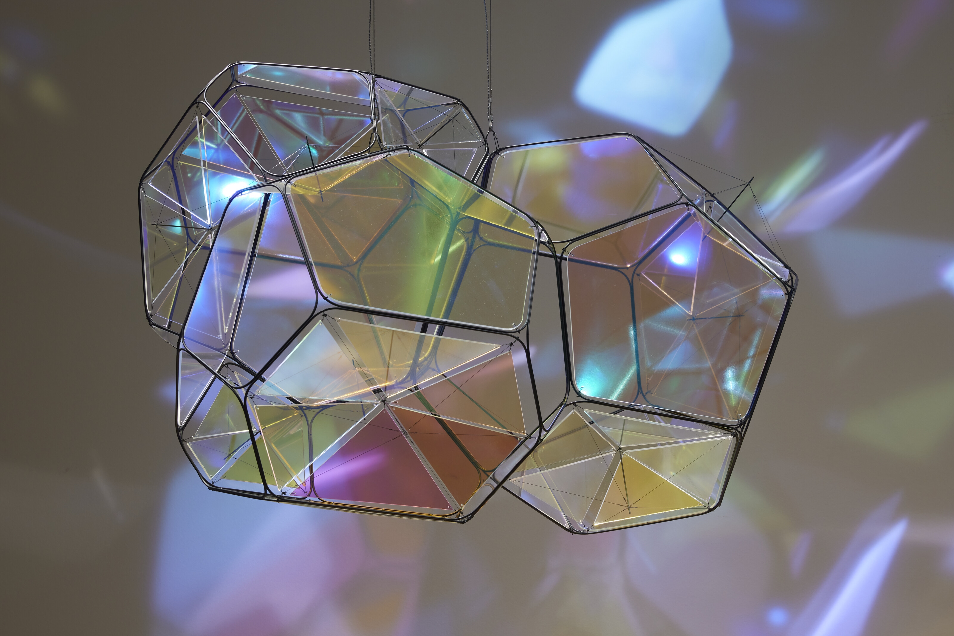 Artwork by Tomas Saraceno, GJ 581 e/M+1, Made of metal, plexiglass, monofiliment, iridescent fishing line, metal wire, carbon fiber and steel thread, in two parts