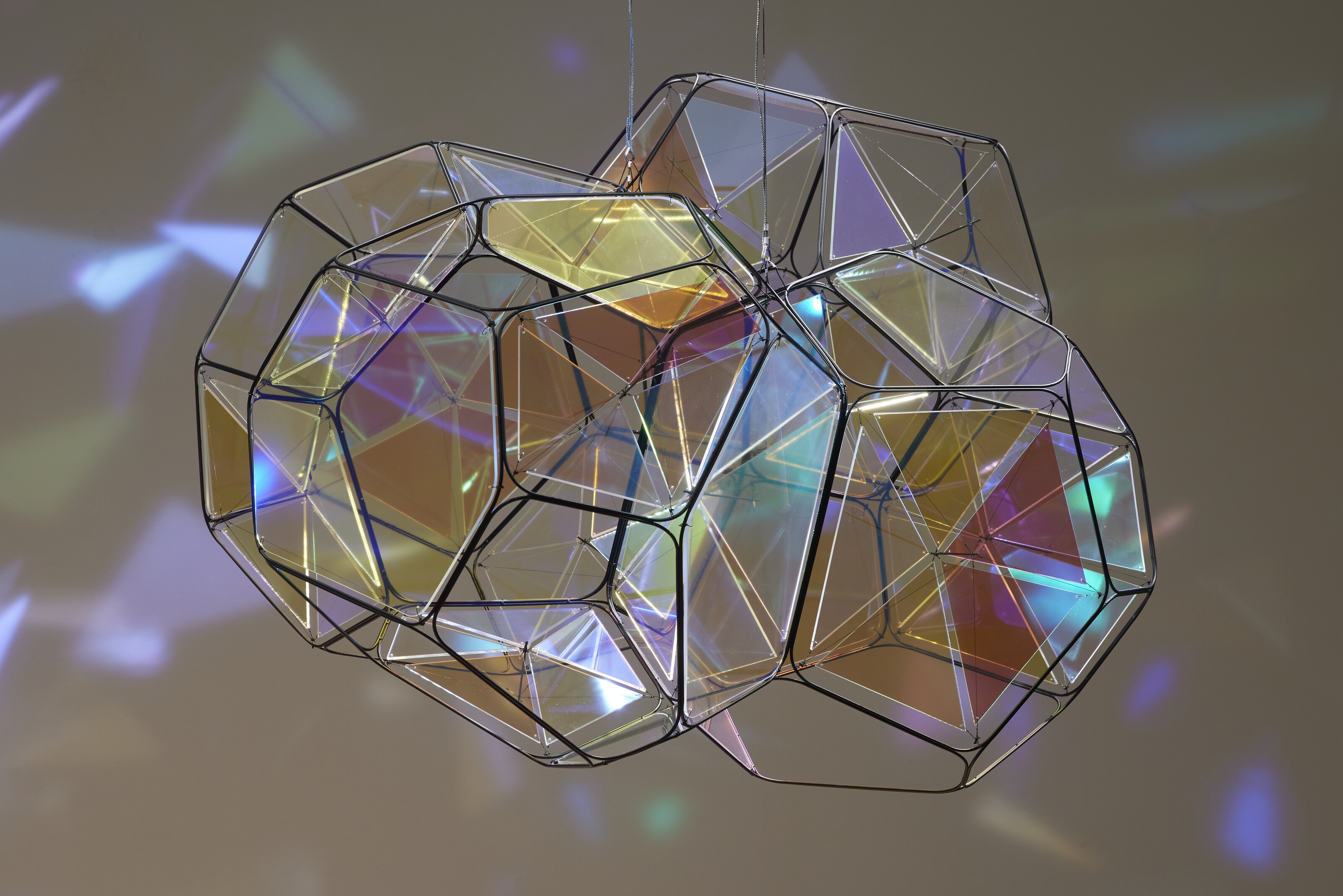 Artwork by Tomas Saraceno, GJ 581 e/M+1, Made of metal, plexiglass, monofiliment, iridescent fishing line, metal wire, carbon fiber and steel thread, in two parts