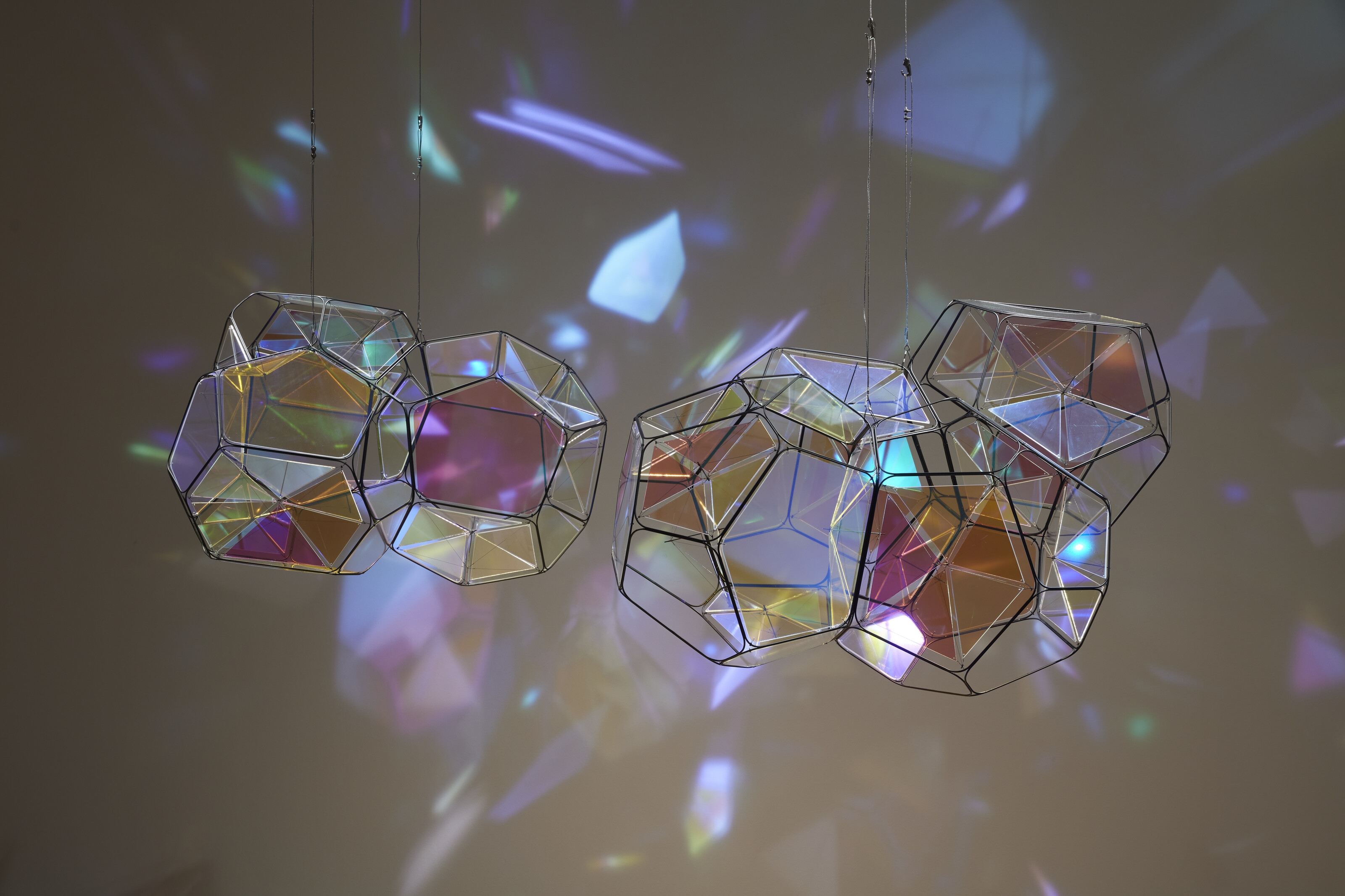Artwork by Tomas Saraceno, GJ 581 e/M+1, Made of metal, plexiglass, monofiliment, iridescent fishing line, metal wire, carbon fiber and steel thread, in two parts