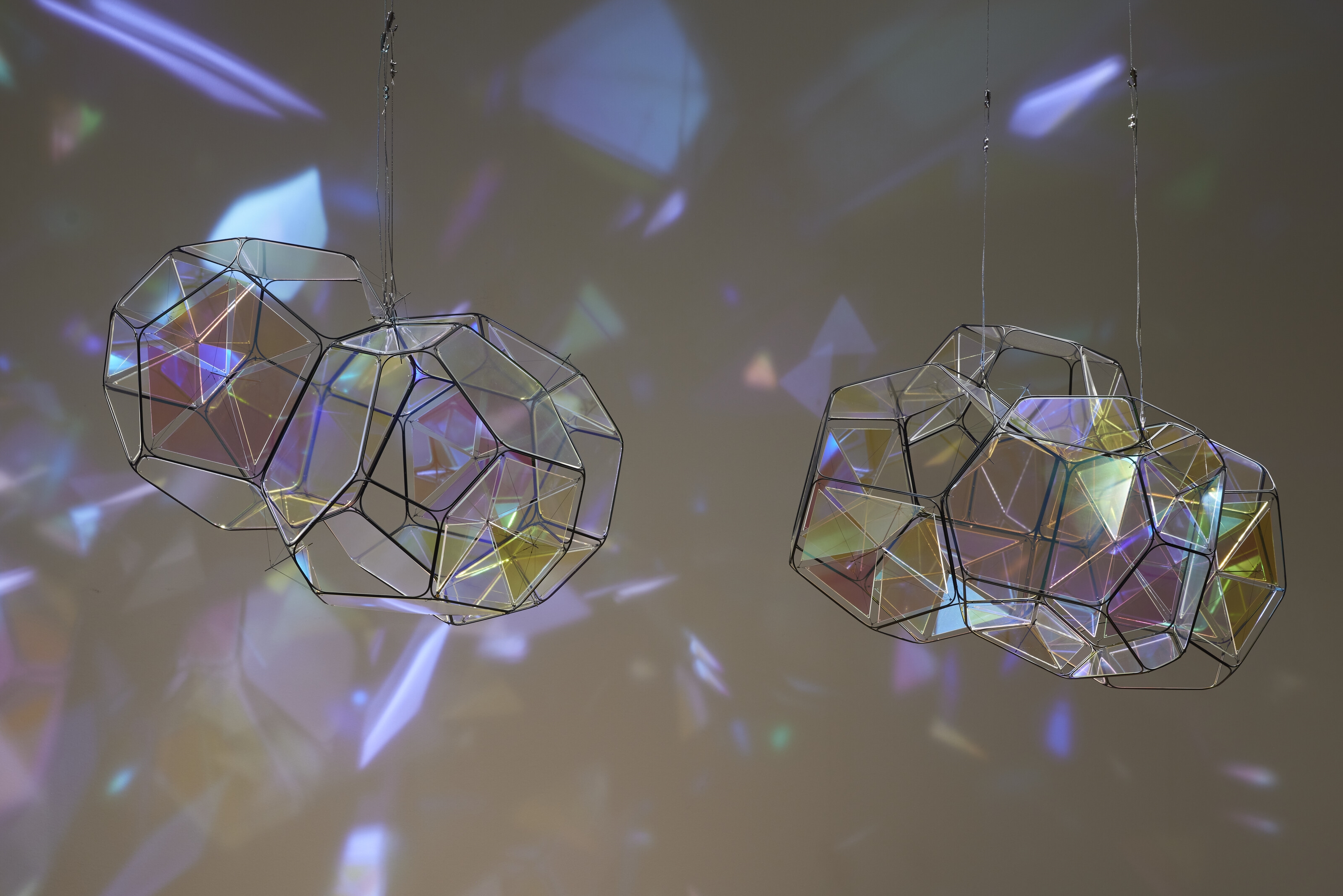 Artwork by Tomas Saraceno, GJ 581 e/M+1, Made of metal, plexiglass, monofiliment, iridescent fishing line, metal wire, carbon fiber and steel thread, in two parts