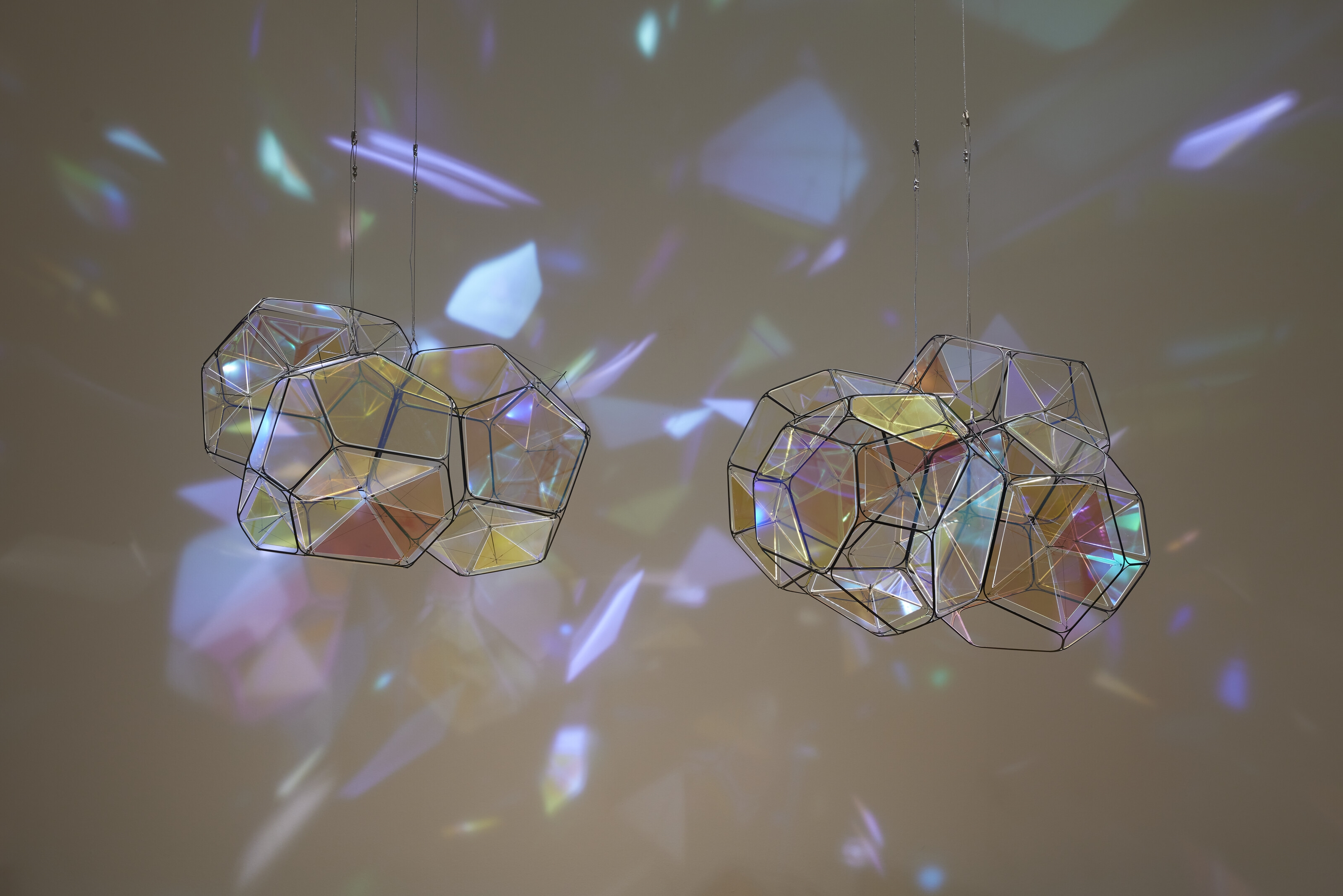 Artwork by Tomas Saraceno, GJ 581 e/M+1, Made of metal, plexiglass, monofiliment, iridescent fishing line, metal wire, carbon fiber and steel thread, in two parts