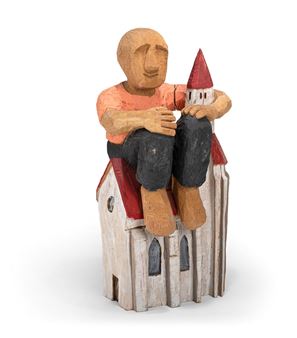 Man sitting on a church. - Daniel Wagenblast