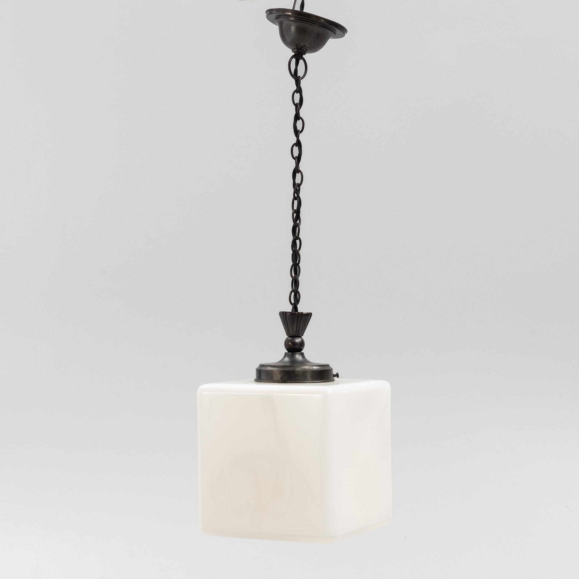 Artwork by Harald Notini, a ceiling lamp, variant of model "10119", Arvid Böhlmarks Lampfabrik, 1930s, Made of glass, wood and leather