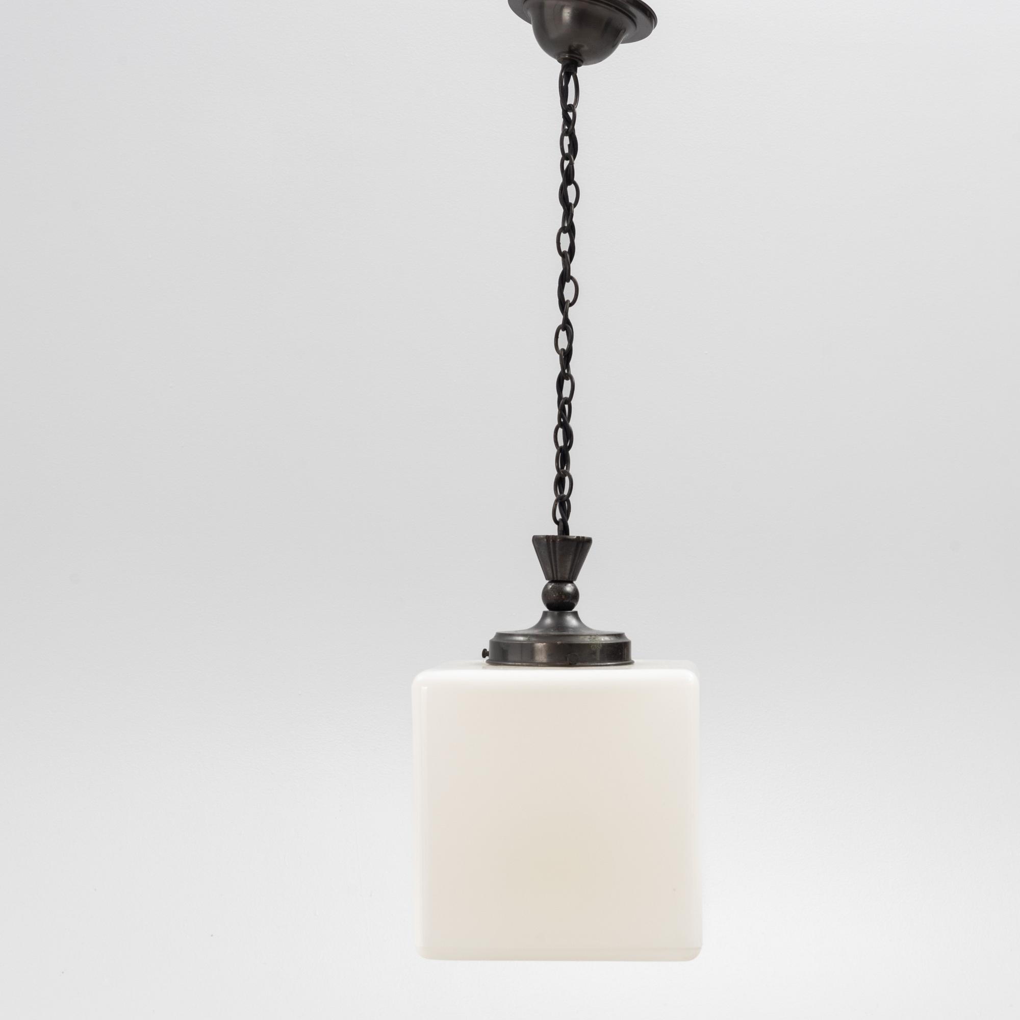 Artwork by Harald Notini, a ceiling lamp, variant of model "10119", Arvid Böhlmarks Lampfabrik, 1930s, Made of glass, wood and leather