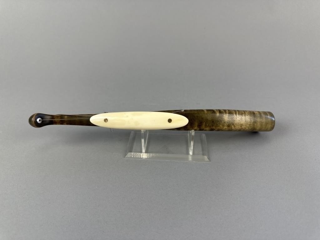 Artwork by Sonny Bashore, Hand Carved Jigging Stock