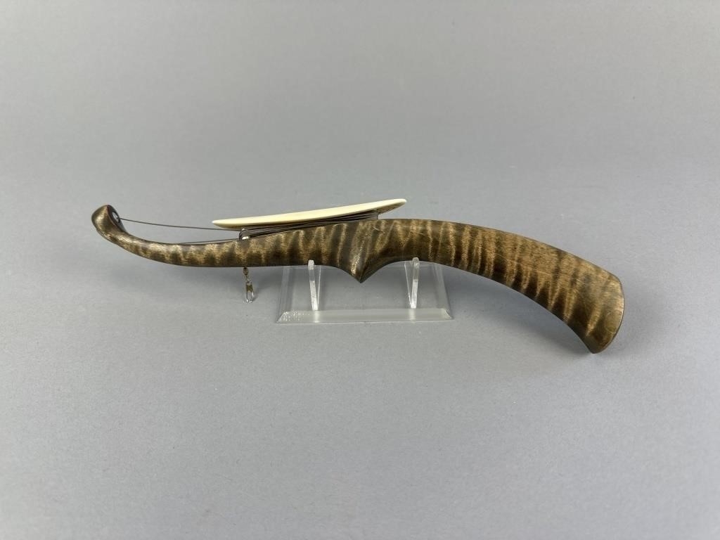 Artwork by Sonny Bashore, Hand Carved Jigging Stock