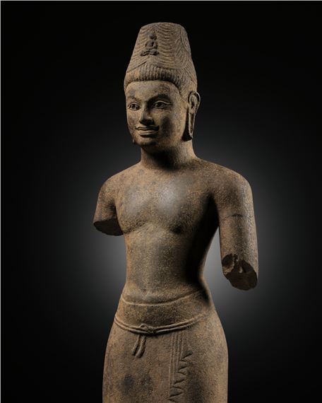 A RARE SANDSTONE FIGURE OF AVALOKITESHVARA, PRAKHON CHAI STYLE, BURIRAM, PRE-ANGKORIAN PERIOD by Thai School, 8th Century, 8th century